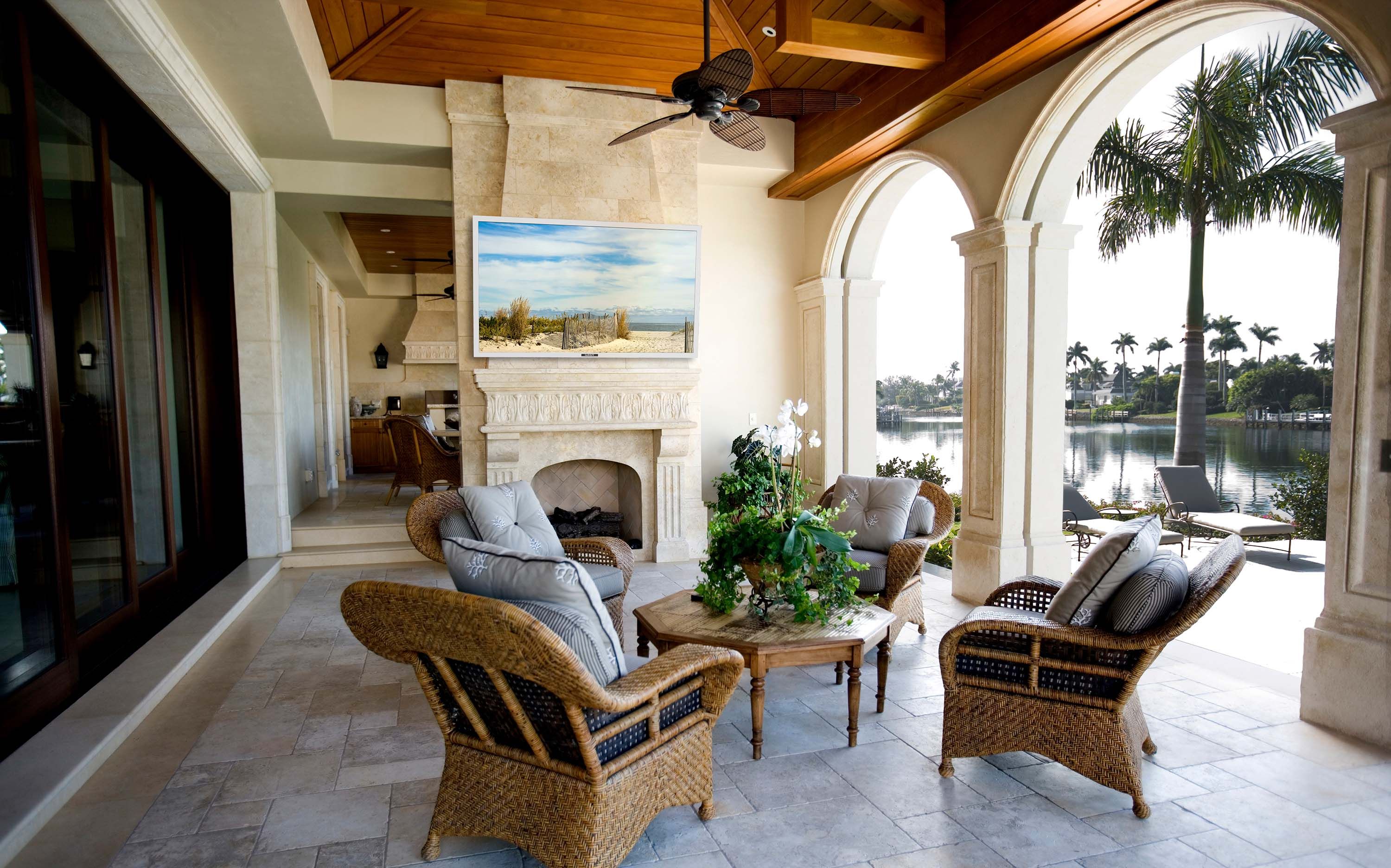 stone patio with a sitting area and outdoor entertainment